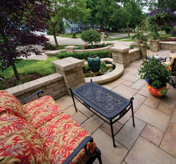 Entrance with Rivenstone paver and garden wall by Unilock