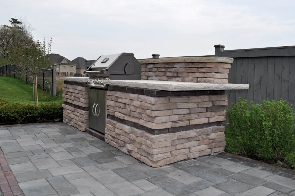 Rivercrest Wall grill island by Unilock