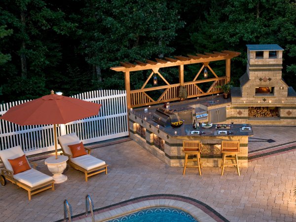 Outdoor Living with Pool Deck and kitchen featuring Brussels Block paver