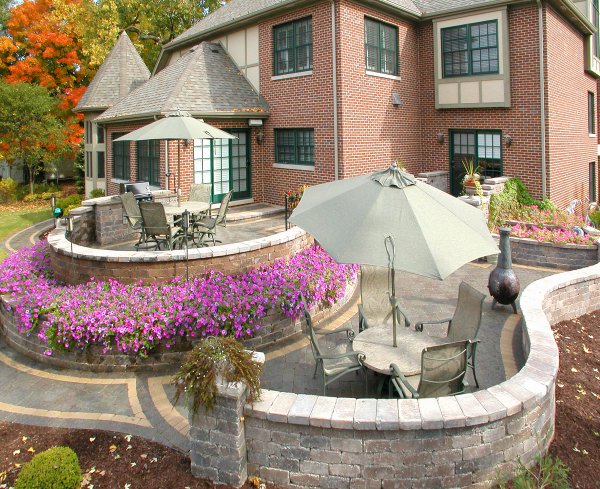 Outdoor Living patio featuring walls and pillars using Unilock Olde Quarry paver