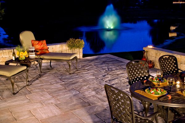 Patio and surround wall by Unilock with Rivenstone paver