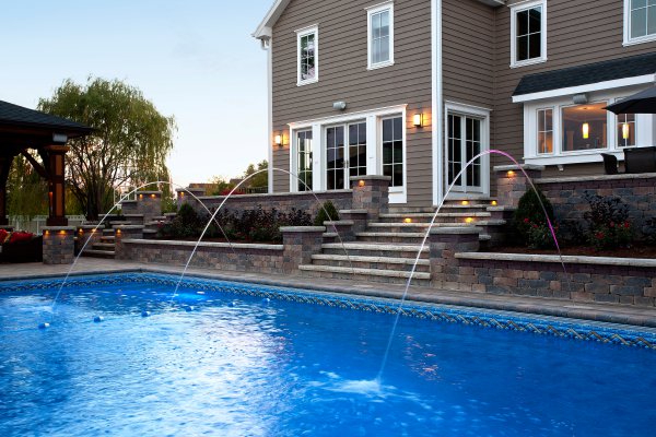 Pool Deck features Brussels Block paver and Brussels Dimensional Wall