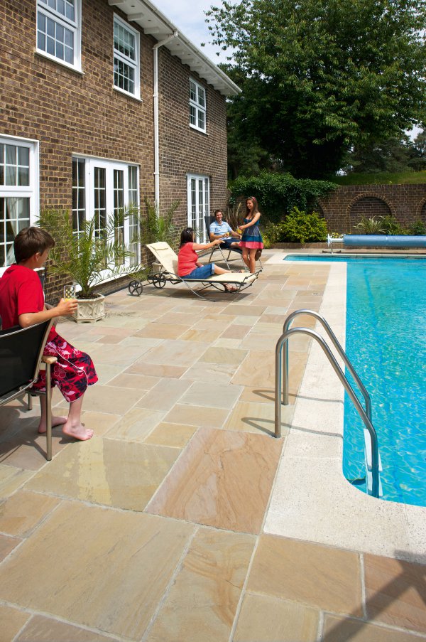 Unilock Patio and Pool with Natural Stone