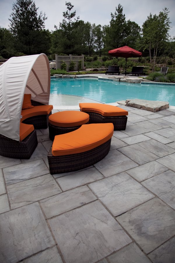 Paver pool deck by Unilock with Rivenstone