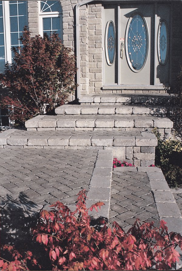 Entrance and steps featuring Unilock Brussels Dimensional wall