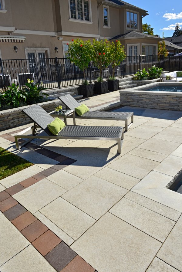 Patio and pool deck by Unilock with Umbriano and Belpasso paver